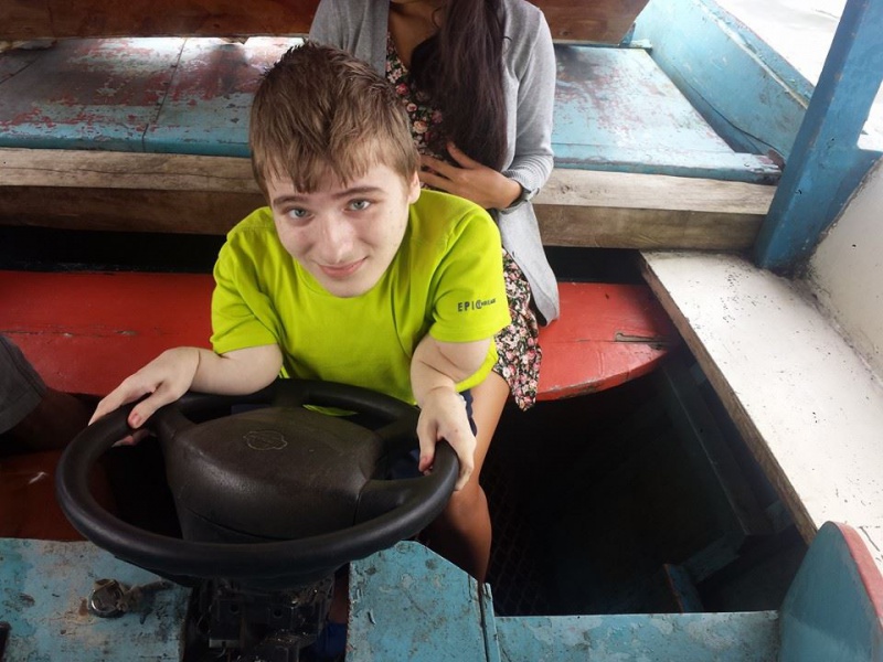 File:Fredrick Brennan drives a boat.jpg